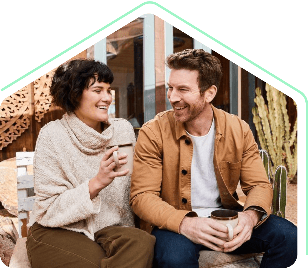 Homeowners enjoying a coffee in their balcony