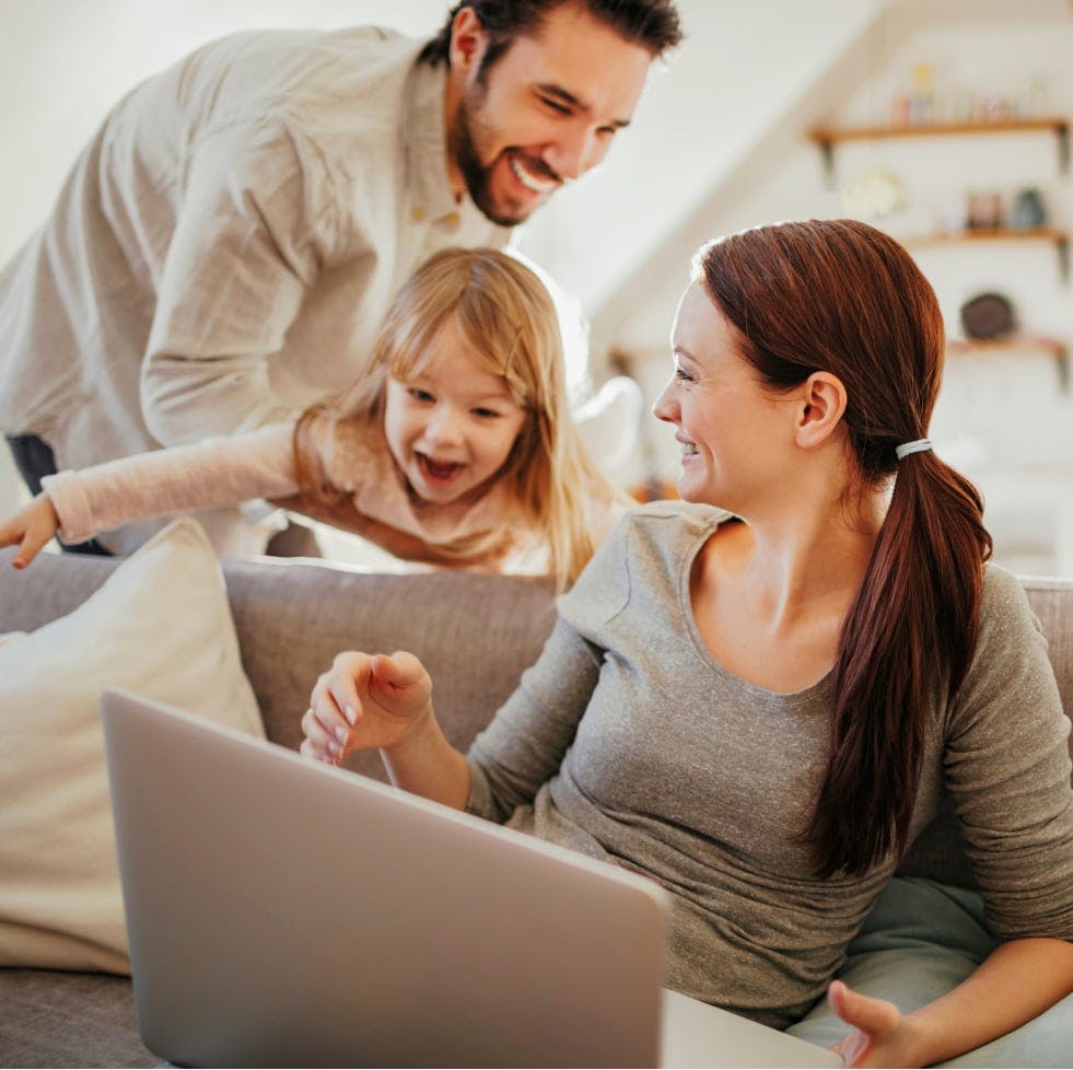 Happy family after a successful cash-out refinance through House Numbers