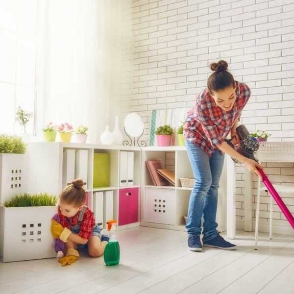 Family cleaning their house to get it ready for house selling